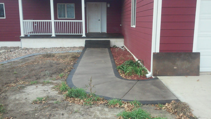 Bordered Sidewalk leating up to Porch