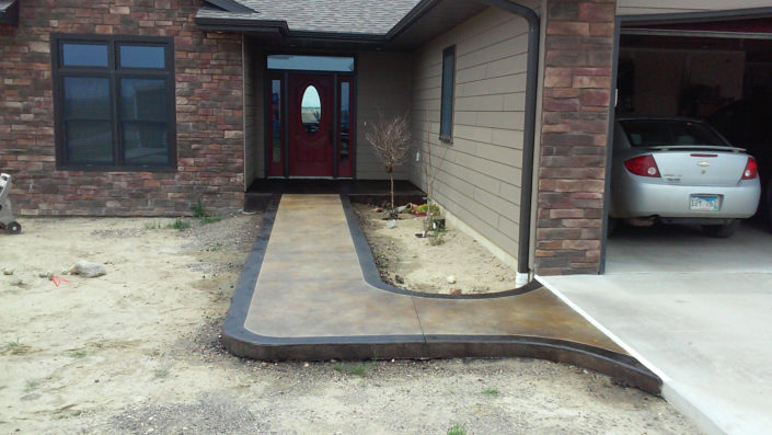 Special Staining & Bordered sidewalk from new Driveway